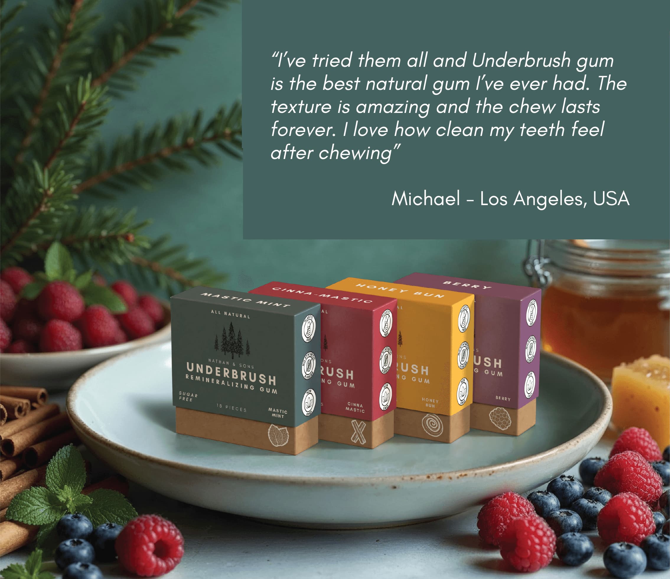 Customer review of Underbrush Remineralizing Gum, praising its natural ingredients, long-lasting chew, and teeth-cleaning benefits, with product boxes in Mastic Mint, Cinna Mastic, Honey Bun, and Berry flavors surrounded by fresh berries and honey.