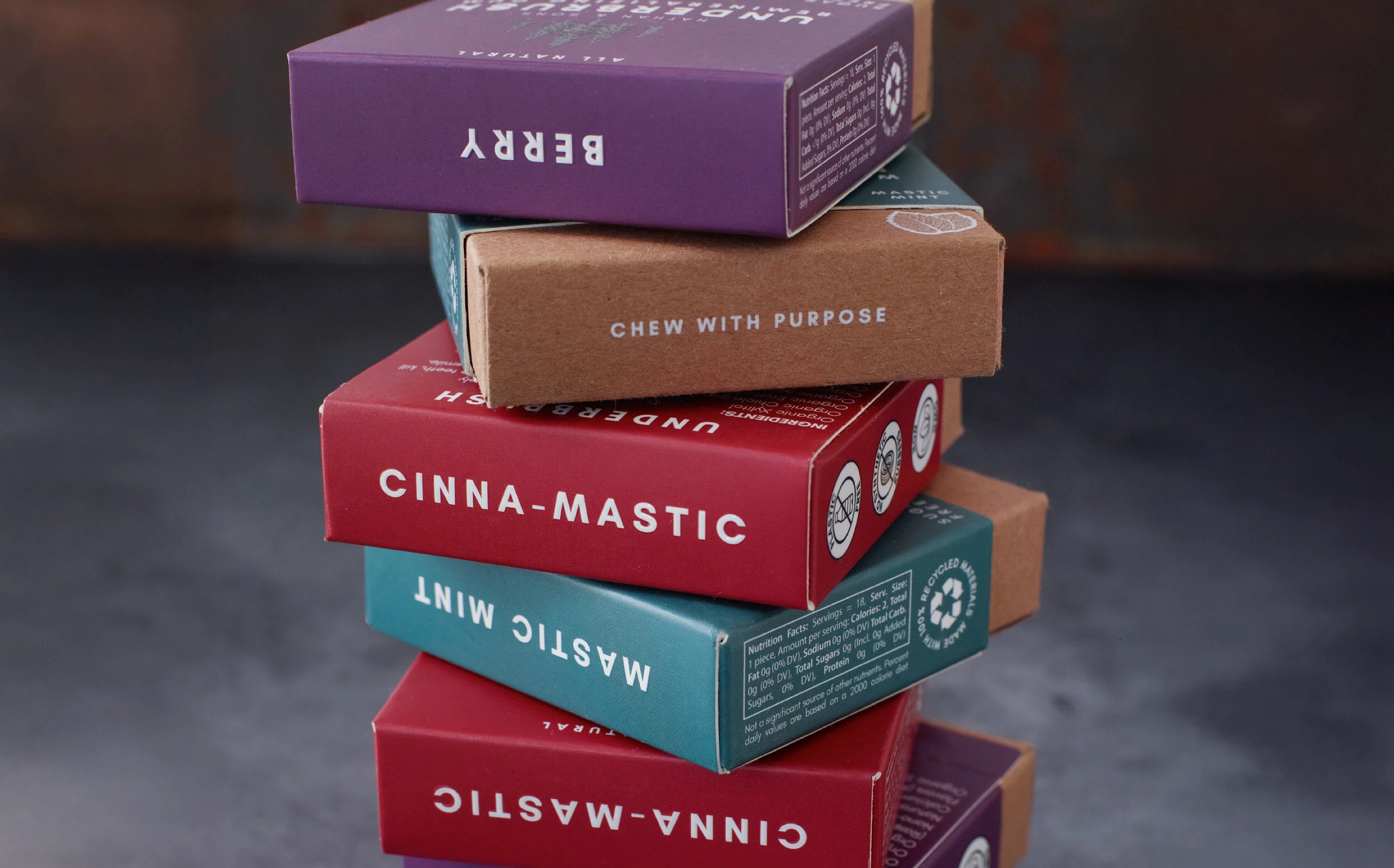 Stack of Underbrush Remineralizing Gum boxes in Berry, Mastic Mint, and Cinna-Mastic flavors