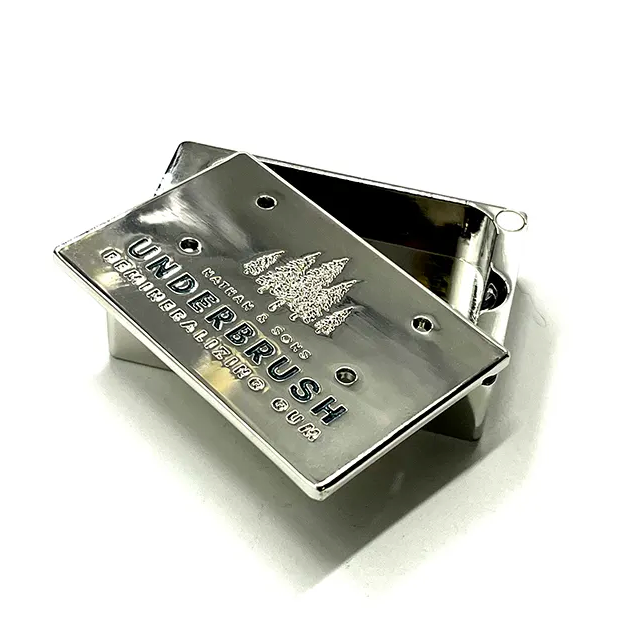 Metallic guitar pickup with 'Underbrush' branding on a white background