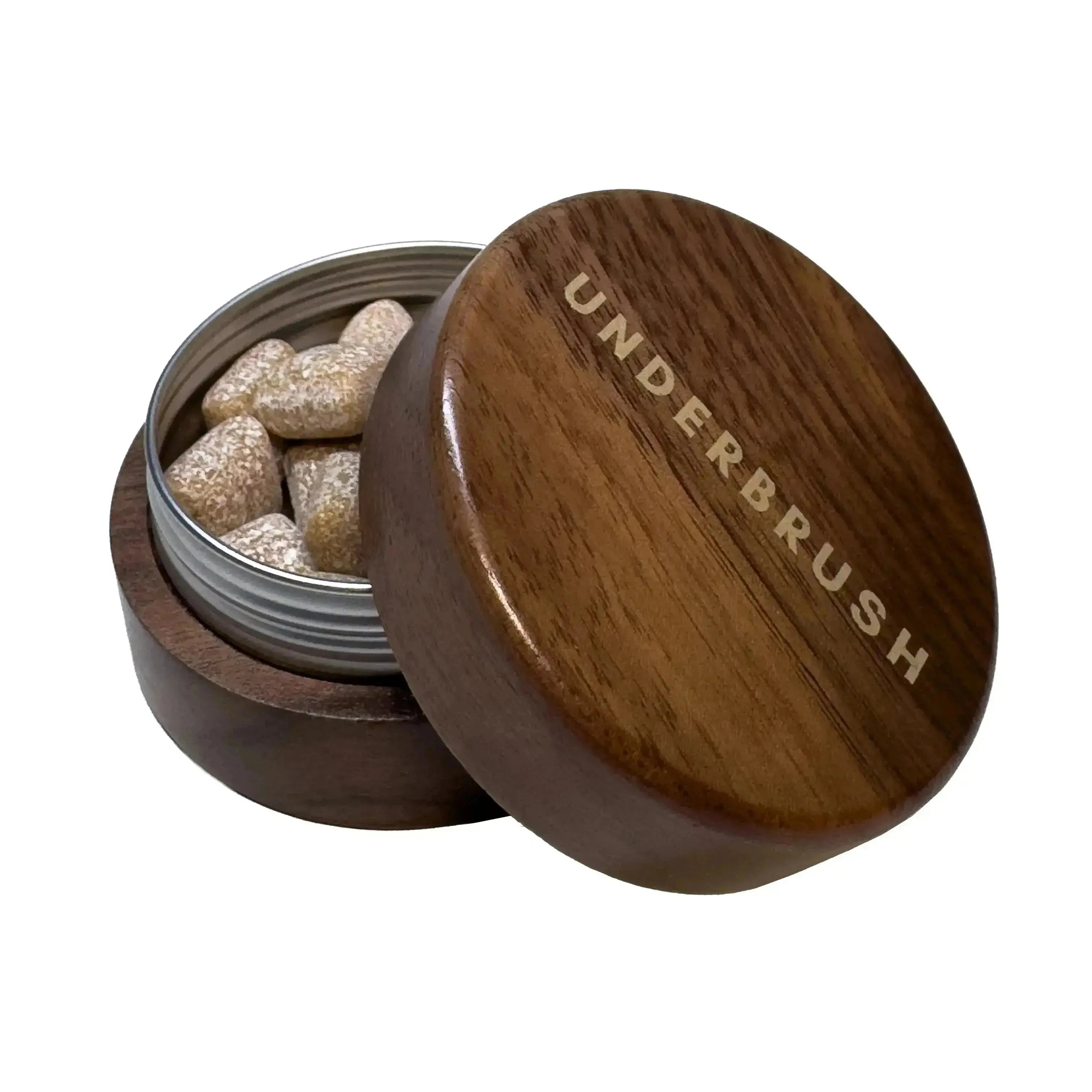 Open American Walnut Gum Case engraved with "UNDERBRUSH," showcasing Underbrush remineralizing gum