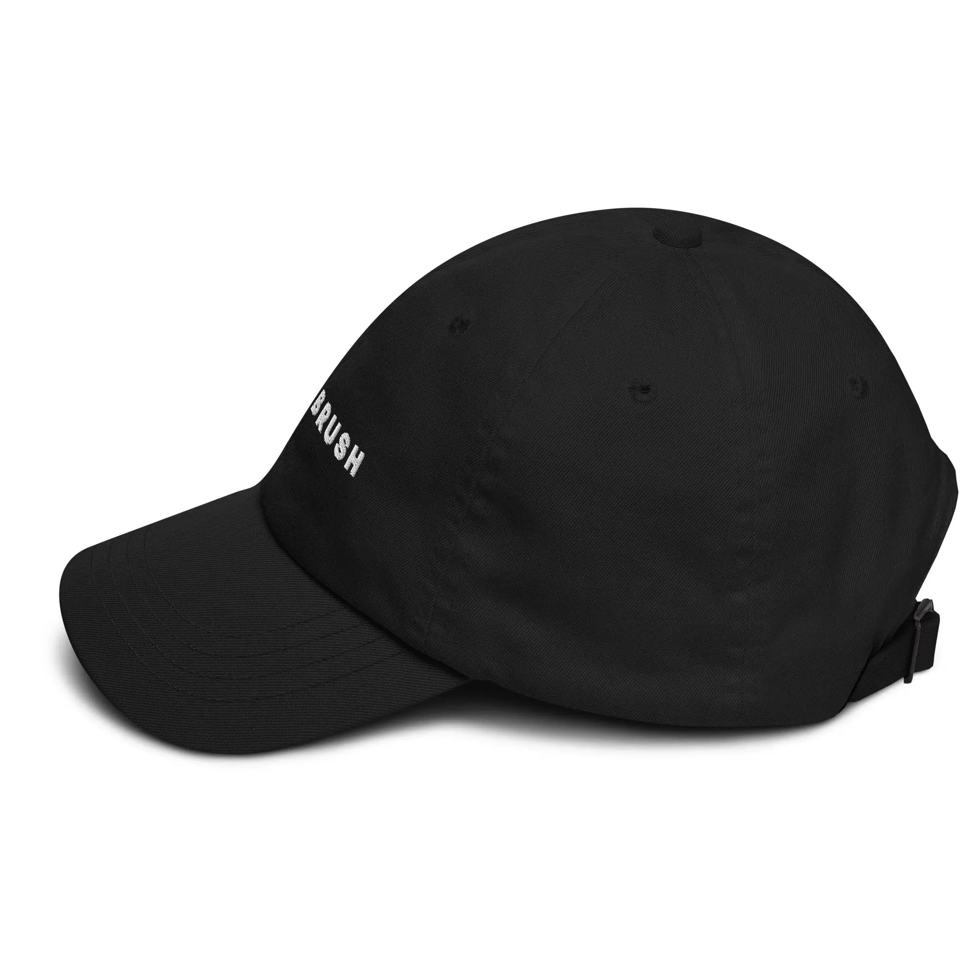 Left side view of product mockup of Black classic dad hat with white embroidered "UNDERBRUSH" logo centered on the front.