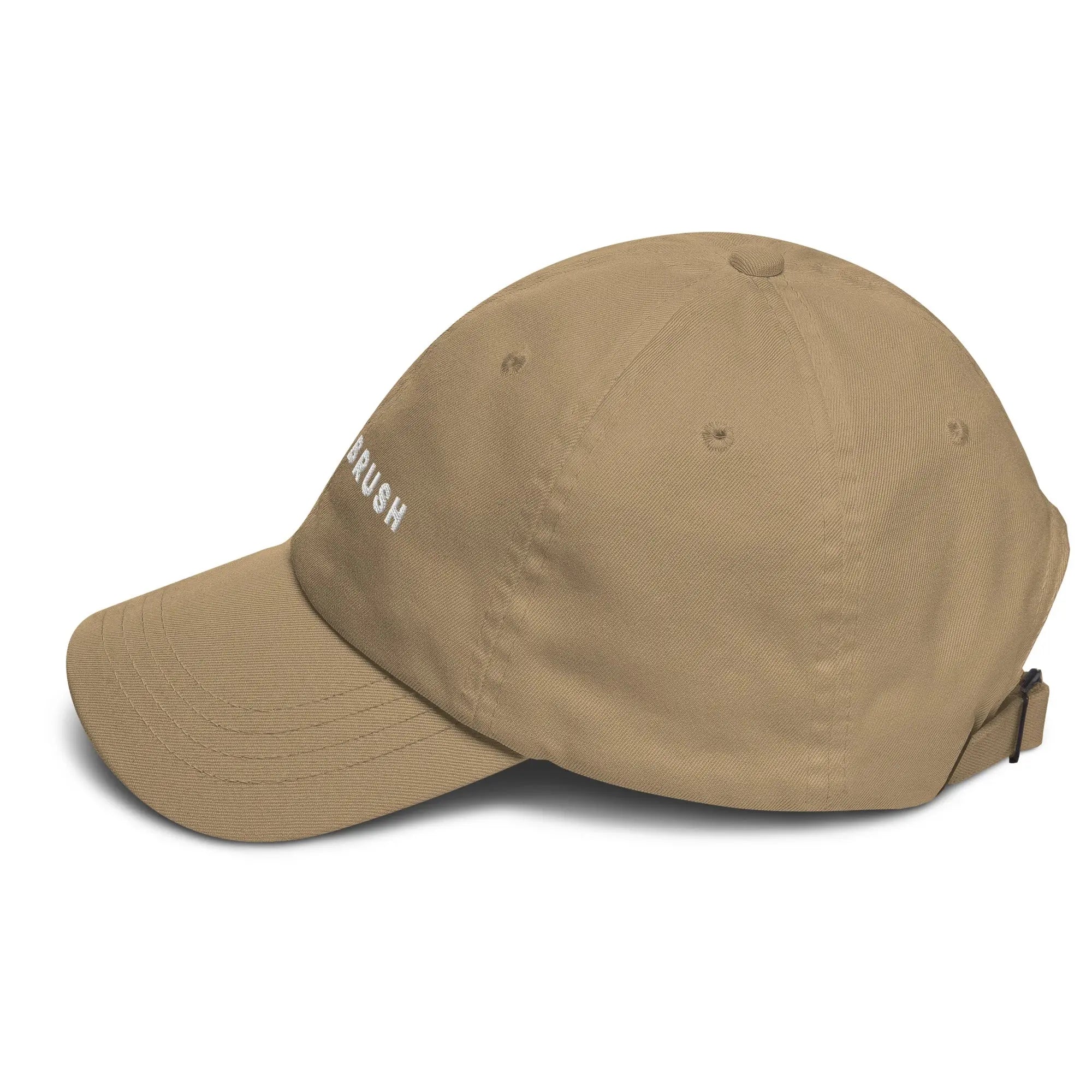 Left side view of product mockup of khaki classic dad hat with white embroidered "UNDERBRUSH" logo centered on the front.