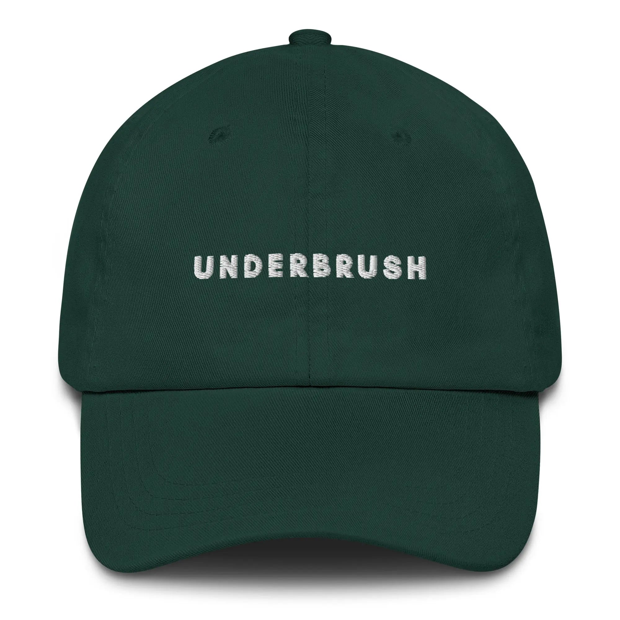 Frontal view of product mockup of spruce classic dad hat with white embroidered "UNDERBRUSH" logo centered on the front.
