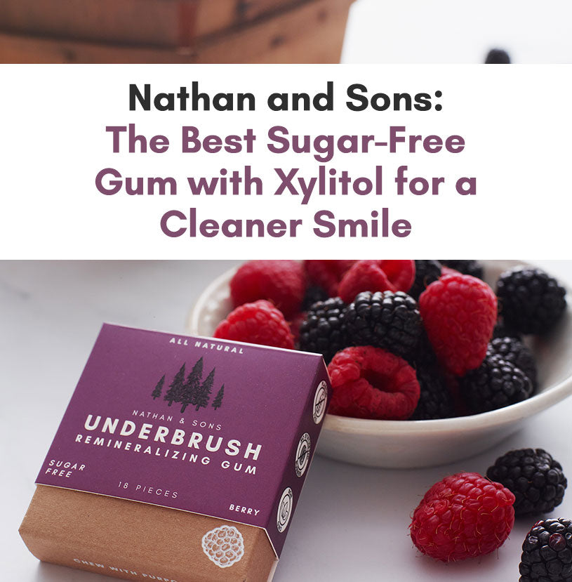 Nathan & Sons Underbrush Berry Remineralizing Gum box placed in front of a bowl of fresh raspberries and blackberries, with text promoting it as the best sugar-free gum with xylitol for a cleaner smile.