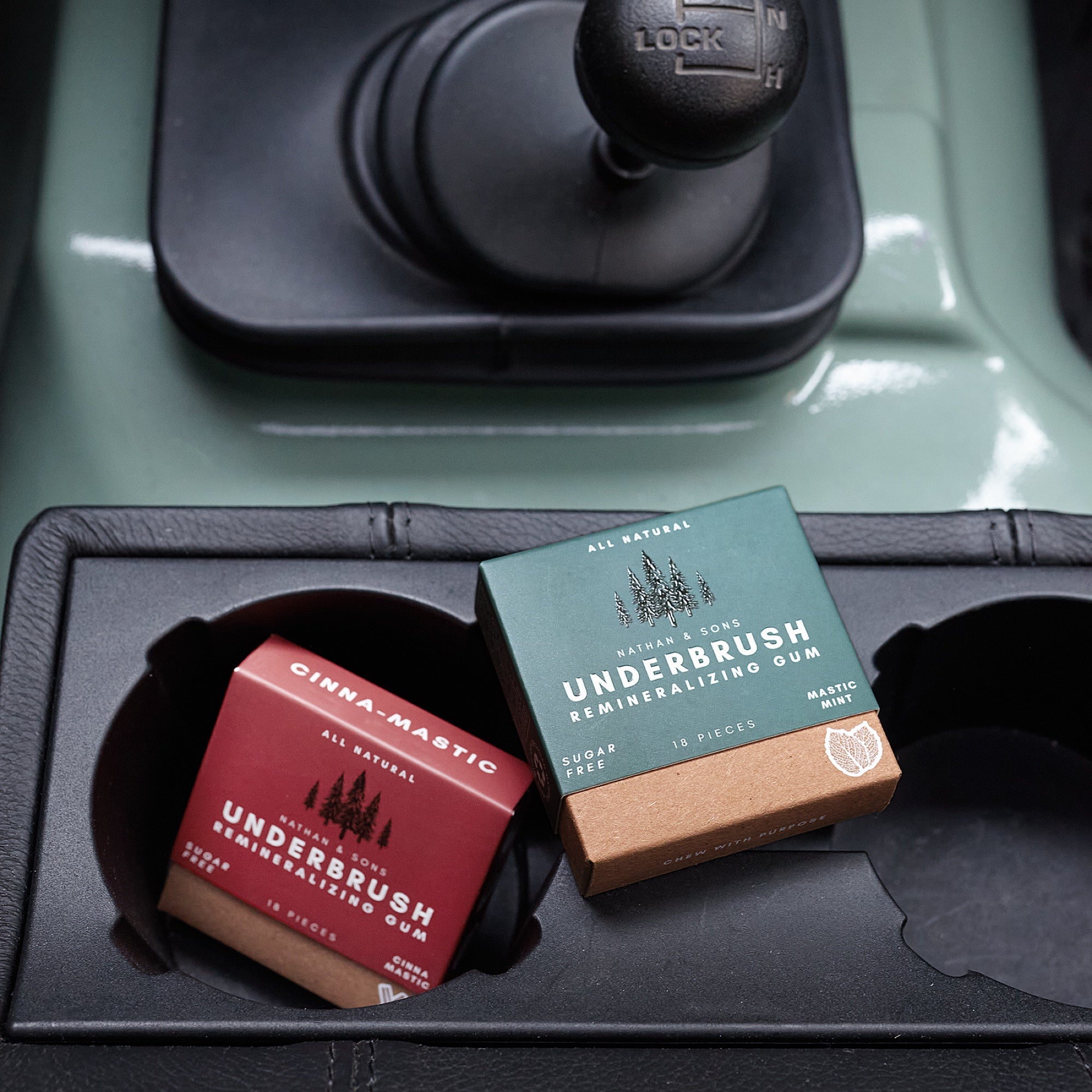Boxes of xylitol chewing gum in a car cup holder